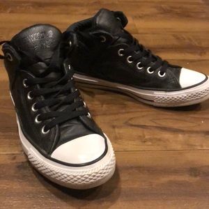Women’s black leather Converse high tops